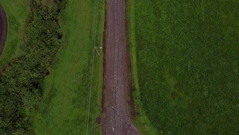 stand-still aerial view of a car driving through machachi area, ecuador