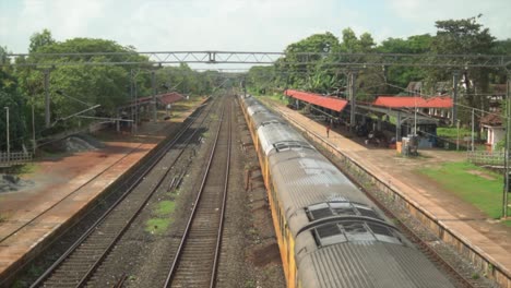 passenger train standing at the railway station, static shot