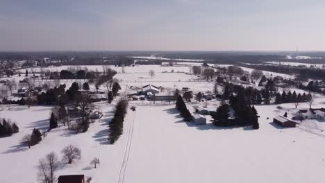 rural landscape covered in snow during wintertime in flat rock, michigan