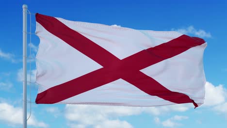 alabama flag on a flagpole waving in the wind in the sky