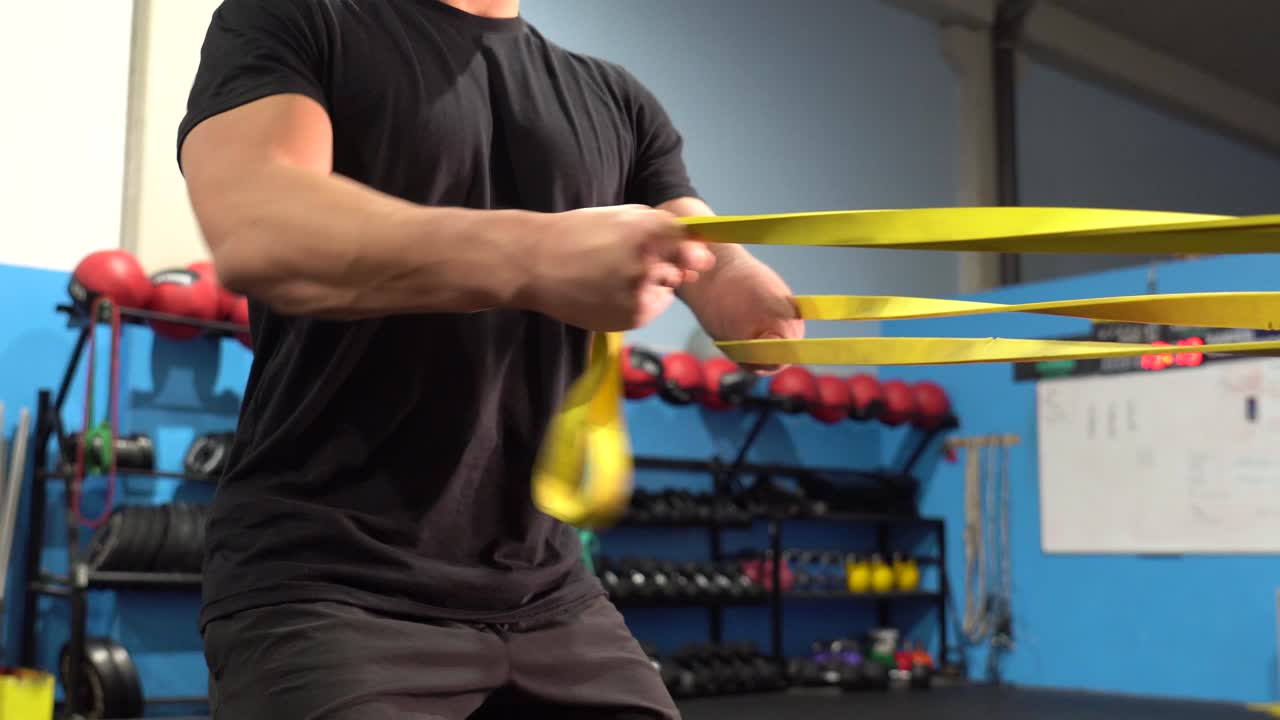 Man exercising with resistance band