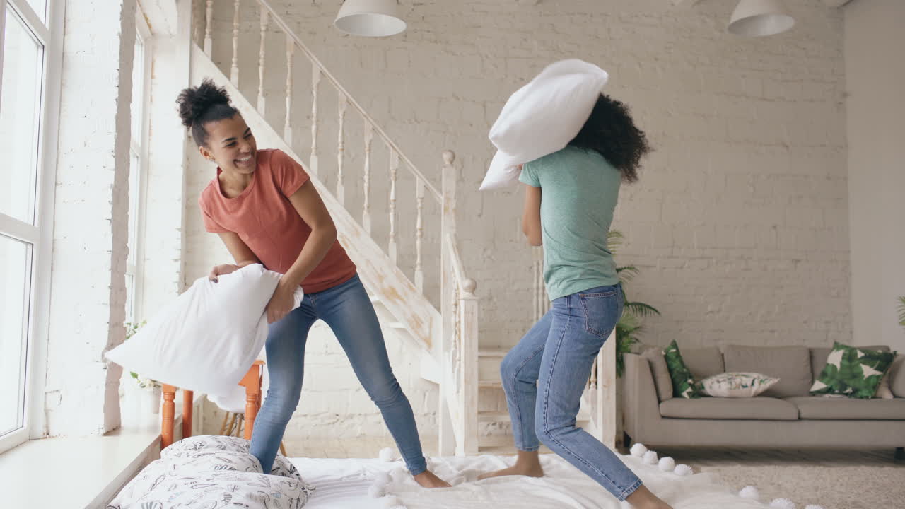 Sisters Having a Pillow Fight