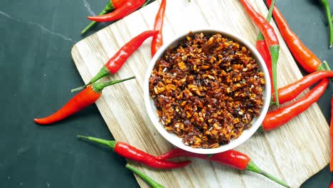 chili and garlic flakes in a container made with coconut oil