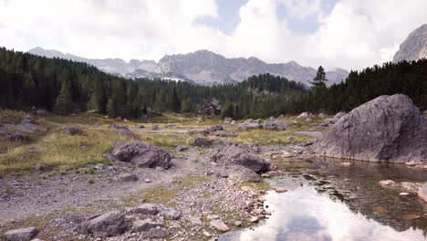 mountain landscape with cabin and lake