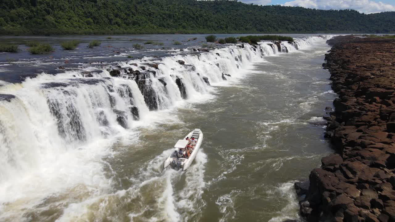 Aerial View Passing over Semirigid Boat Going up Against the Strong Streams of Mocon&aacute; Waterfalls
