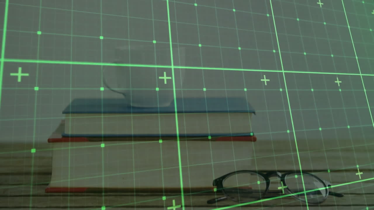 Stack of books being displayed in augmented reality, showing eyeglasses and green grid overlay