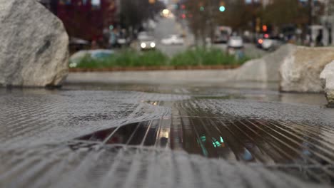 traffic reflecting in flowing waves of water