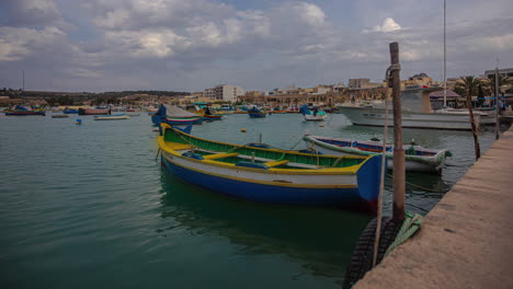 traditional colorful boats of fishermen in malta, time lapse view