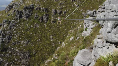 young caucasian man zip lining