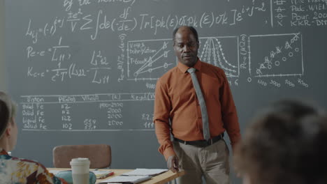 african american professor giving a lecture in a science classroom