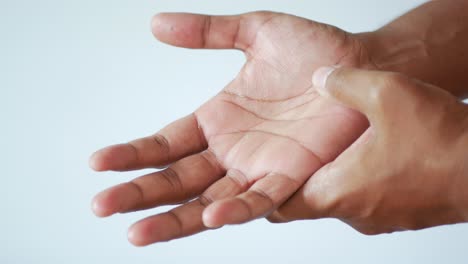 man suffering pain in hand close up