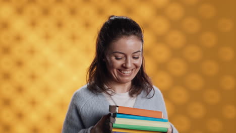 joyous person walking with pile of novels, feeling delighted, studio background