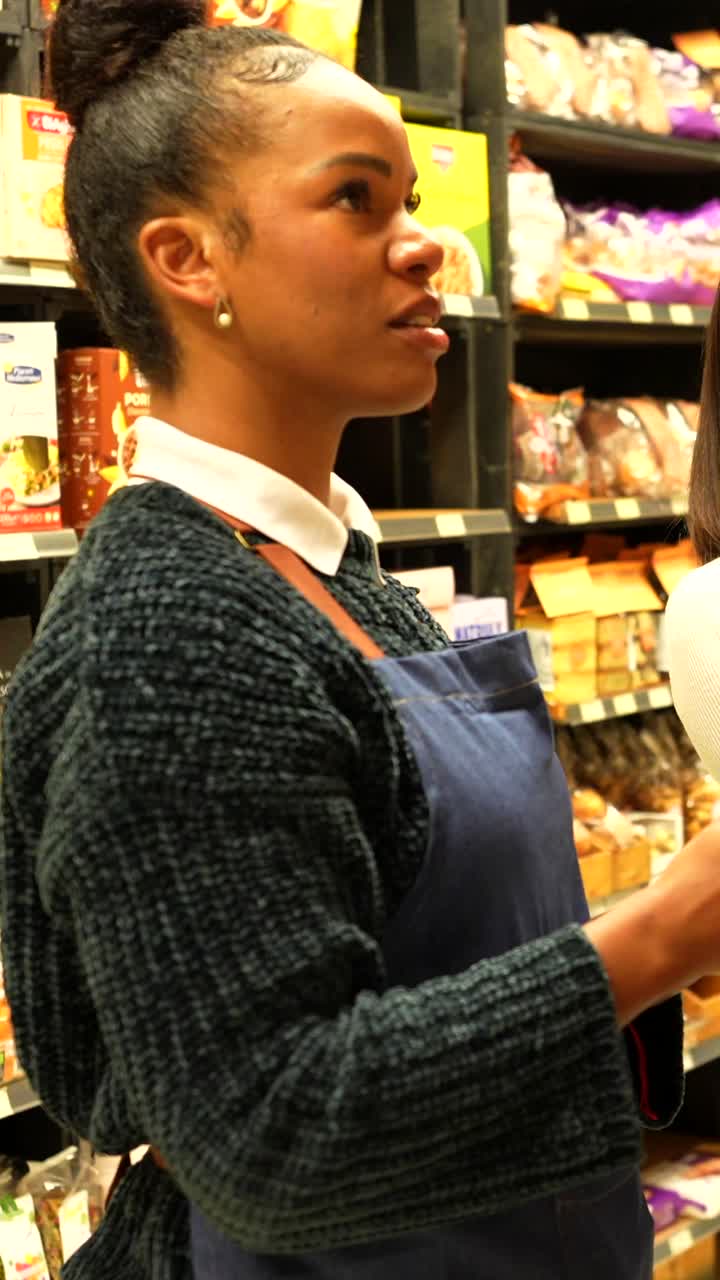 Two women shopping at a grocery store