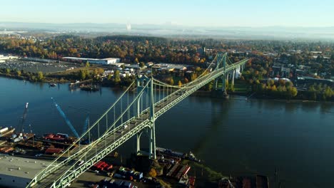 usa, or, portland, st. johns bridge, 2024-11-07 - drone view of the bridge at dawn. the city is st. johns and mt st. helens is visible with snow. mt baker is further away on the right.