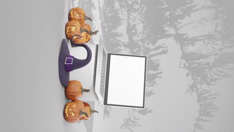 laptop with blank screen mockup for advertisement, halloween theme, vertical