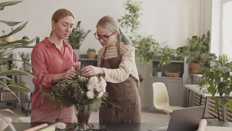 Women Florists Working Together in a Floral Shop