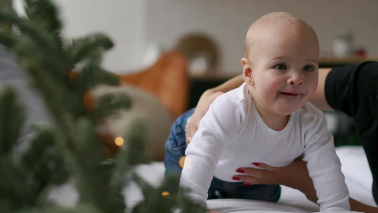 happy loving family. mother playing with her baby in the bedroom.