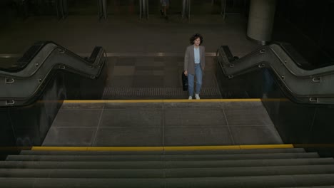 woman walking up stairs in a modern building