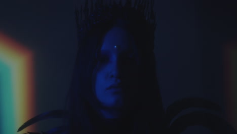 gothic girl in crown and feathers