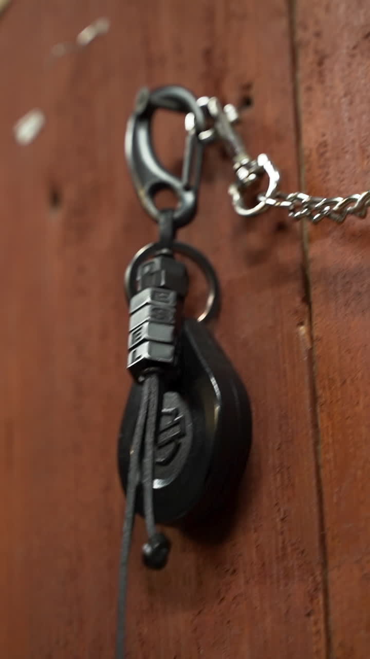 Installing security chain on wooden wall