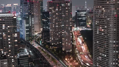 beautiful urban city view full of skyscrapers and lights in the evening - timelapse