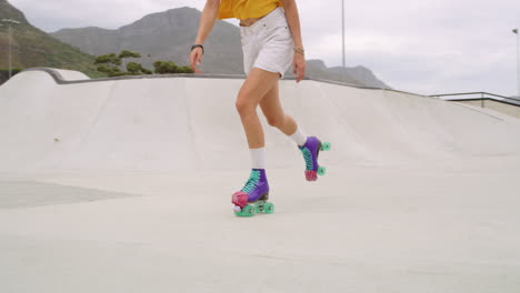 Closeup of a woman roller skater&#039;s legs skating