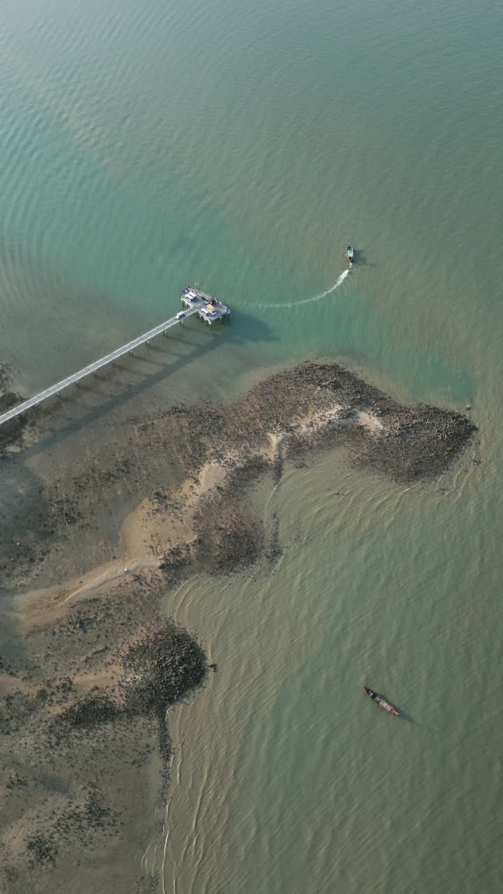 Aerial View of a Coastal Pier and Boats