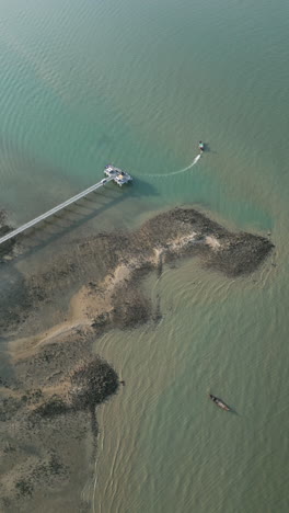 aerial view of a coastal pier and boats