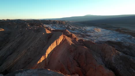 Aerial footage of the Atacama Desert’s Moon Valley, glowing orange and gold under the evening sun