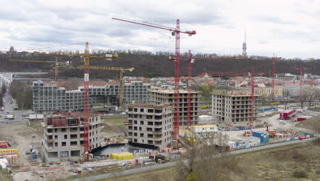 Construction site in Prague city with cranes and building material