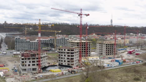 construction site in prague city with cranes and building material