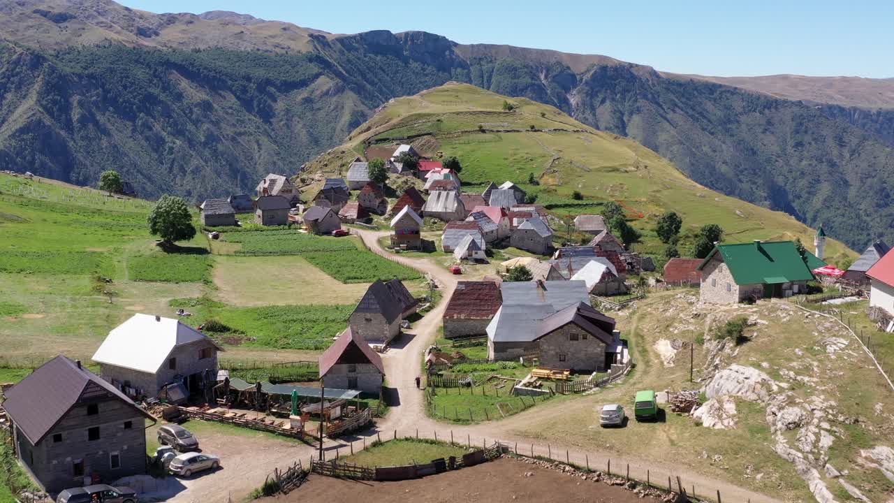 High aerial approaching view of quaint small village on mountaintop, Bosnia