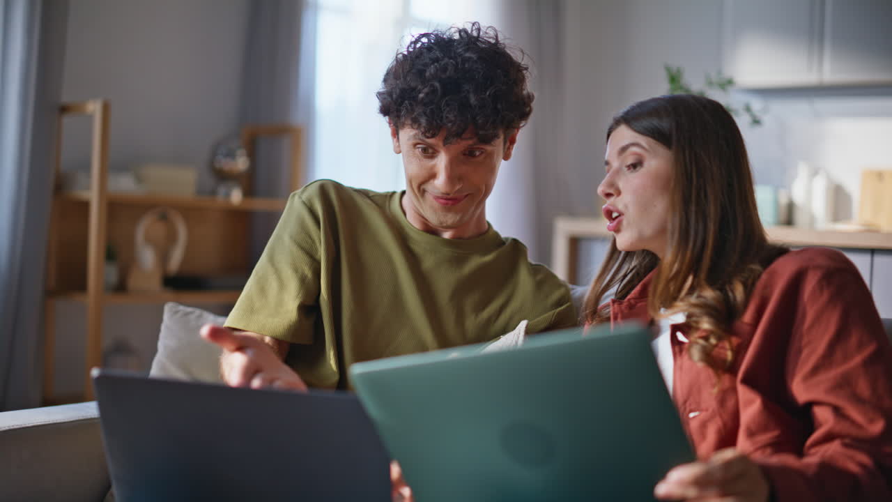 Freelancers family working online laptops closeup. Happy couple sharing opinions