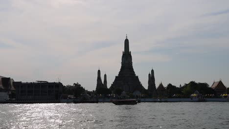 time-lapse of wat arun across the chao phraya river