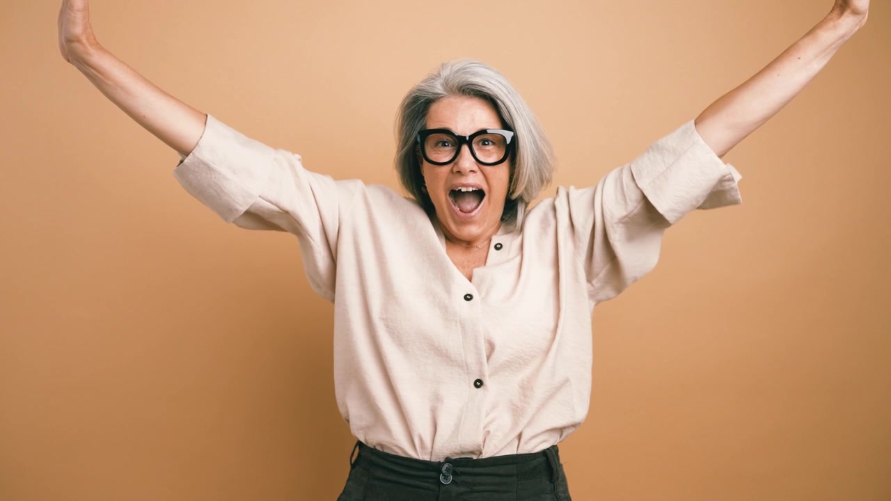 Surprised Senior Woman Expressing Shock and Excitement