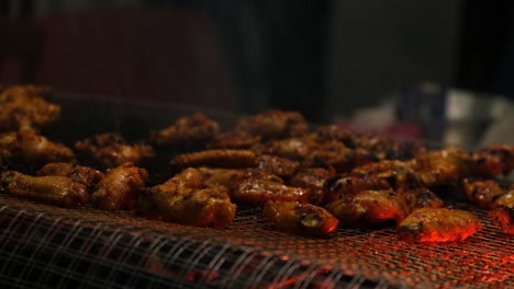 view of tasty chicken wings barbecued on bbq grill