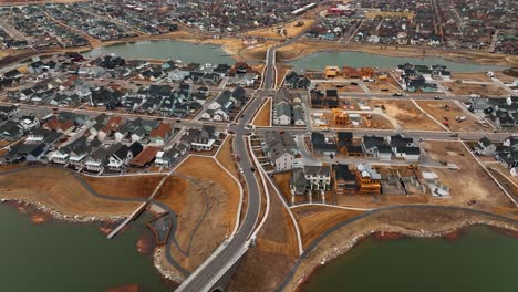 awesome top view from island road at the island in daybreak in south jordan utah - aerial tilt down shot