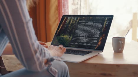 home office setup with woman working on laptop, representing focus, comfortable workspace.