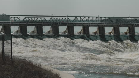 water rushing through the levee of the hydro electric dam on the ottawa river at chaudiã¨re island in downtown ottawa, canada