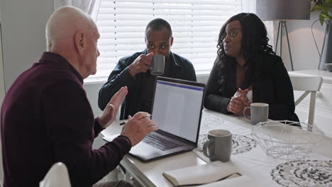 people having a meeting at the table