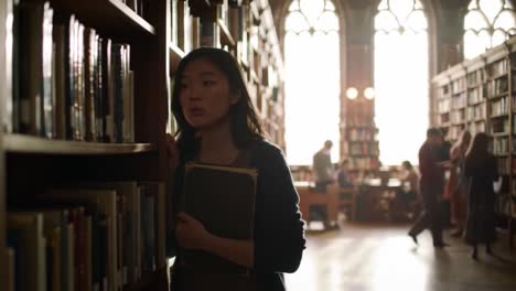 a contemplative young woman wanders through a library filled with books, basking in the soft light filtering through ornate windows, lost in thought as she embraces her academic journey