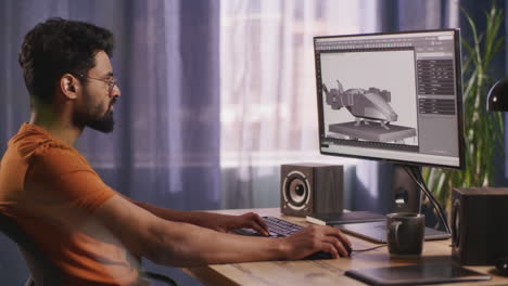 man working on 3d design project on computer