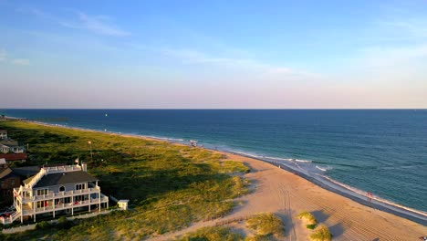 in north carolina droning over a beach and heading towards a kite boarder in the distance