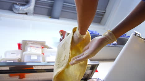 chef cooking dough at kitchen. chef in uniform spinning and tossing pizza