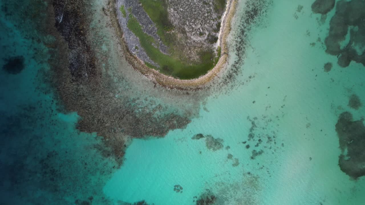 Turquoise water and coral reefs in los roques, peaceful and stunning , aerial view
