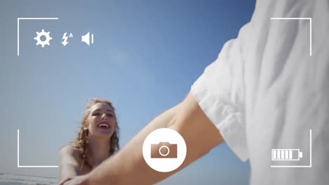 tomando fotos de una pareja con una cámara digital