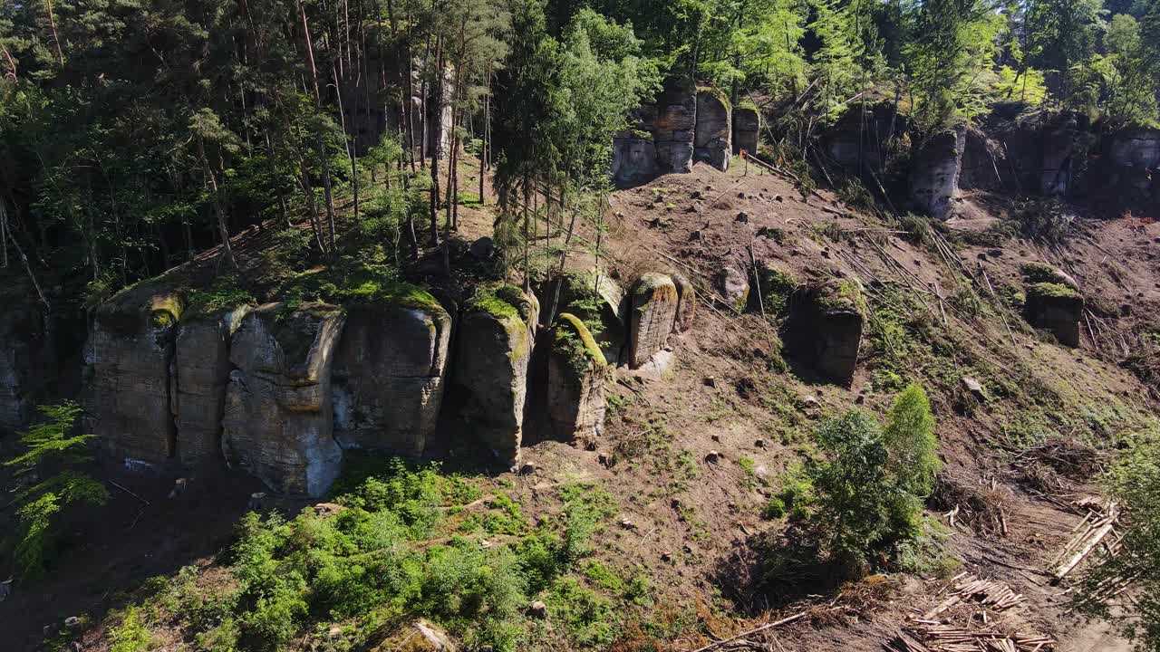 Drone of dramatic cliff formations surrounded by forest near the Castle Kokorin