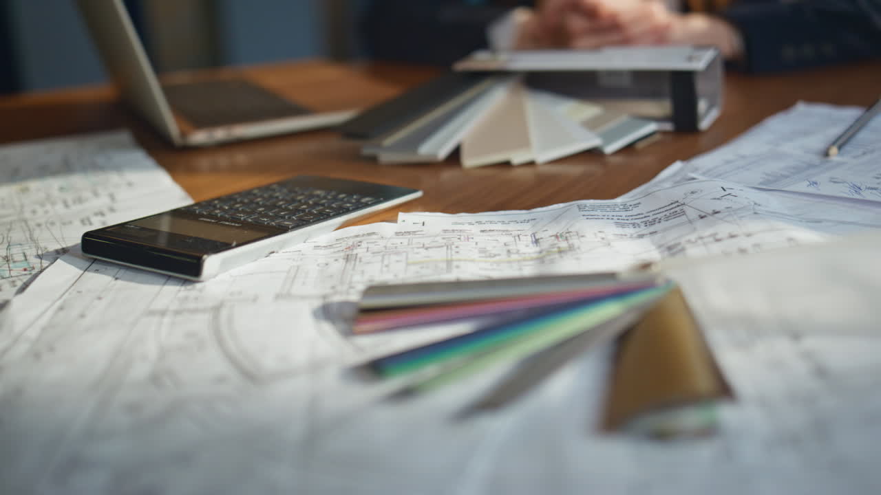 Technical blueprints desk office closeup. Architectural plans on workspace