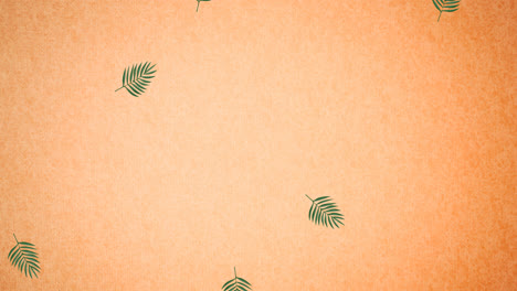 animation of green leaves on orange background