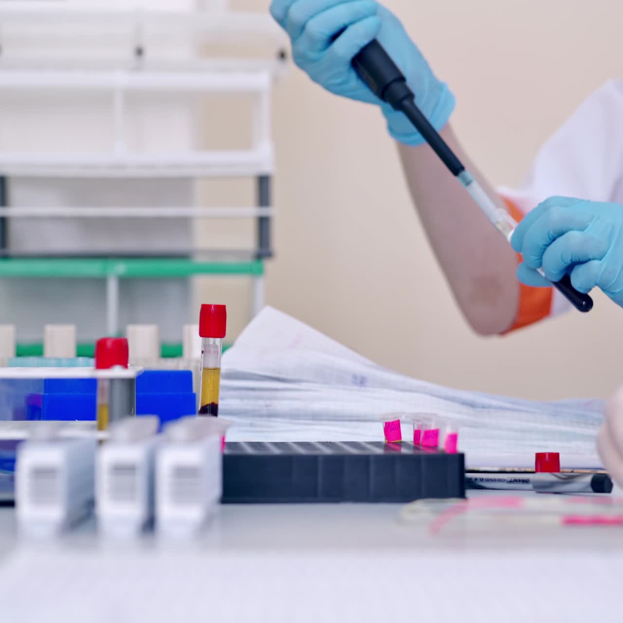 Medical lab researcher with blood sample